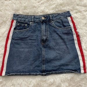 Denim skirt with red and white lines on the sides.